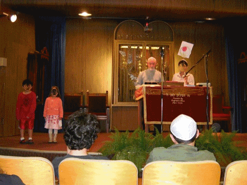 Series of photos showing the reading of the Megilah, playing games, watching Purim videos, and eating and drinking kosher food and beer (adults only). Series of photos showing the reading of the Megilah, playing games, watching Purim videos, and eating and drinking kosher food and beer (adults only).